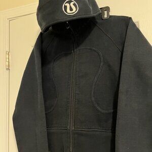 Lululemon black Scuba hoodie with white embroidered logo.